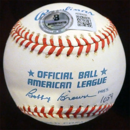 Baseball with 'Official Ball American League' text and a signature on a dark background