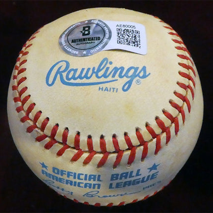 Baseball with Rawlings branding and an authentication label on a dark background