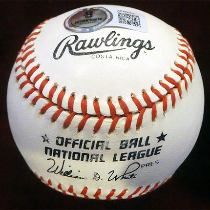 Rawlings baseball with red and white stitching on a dark background