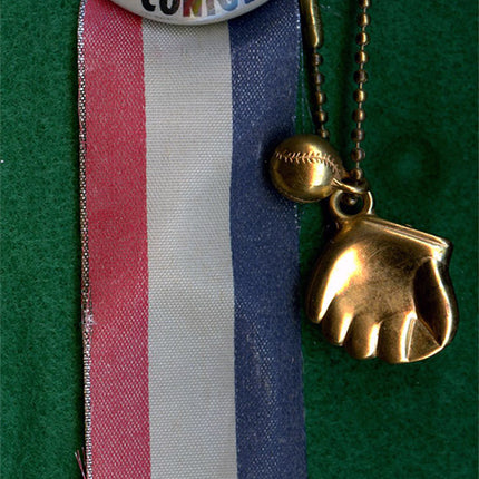 Button badge with a portrait of  baseball player Tony Conigliaro and a ribbon on a green background
