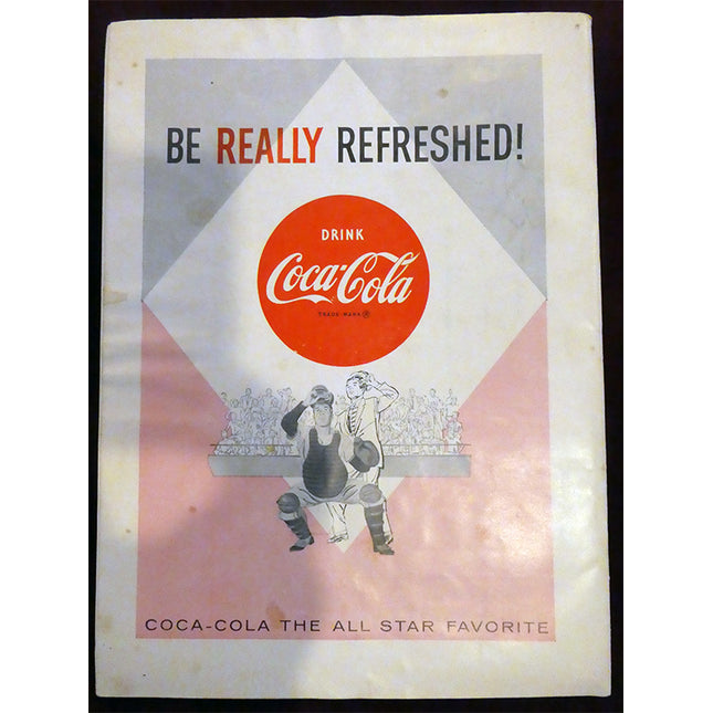 Vintage Coca-Cola advertisement with two people and a sports theme.