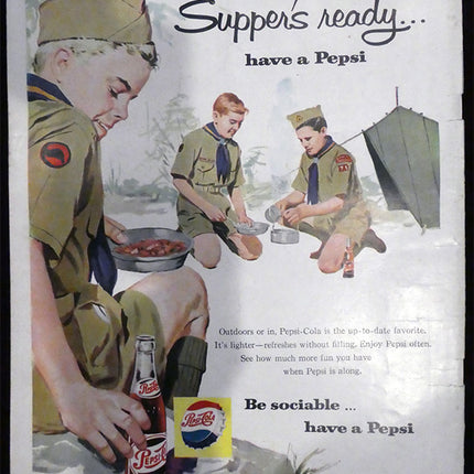 Back of magazine depicts a vintage Pepsi advertisement featuring Boy Scouts around a campfire with a bottle of Pepsi.